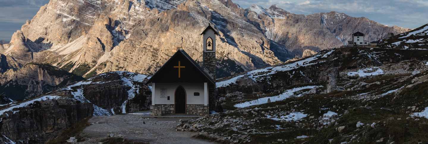 Beautiful small church in the snowy italian alps in winter