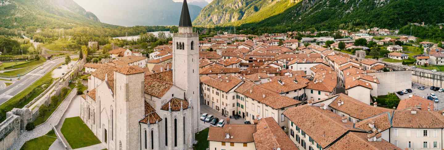 Aerial panoramic view of s. andrea apostolo cathedral of venzone, northern italy.