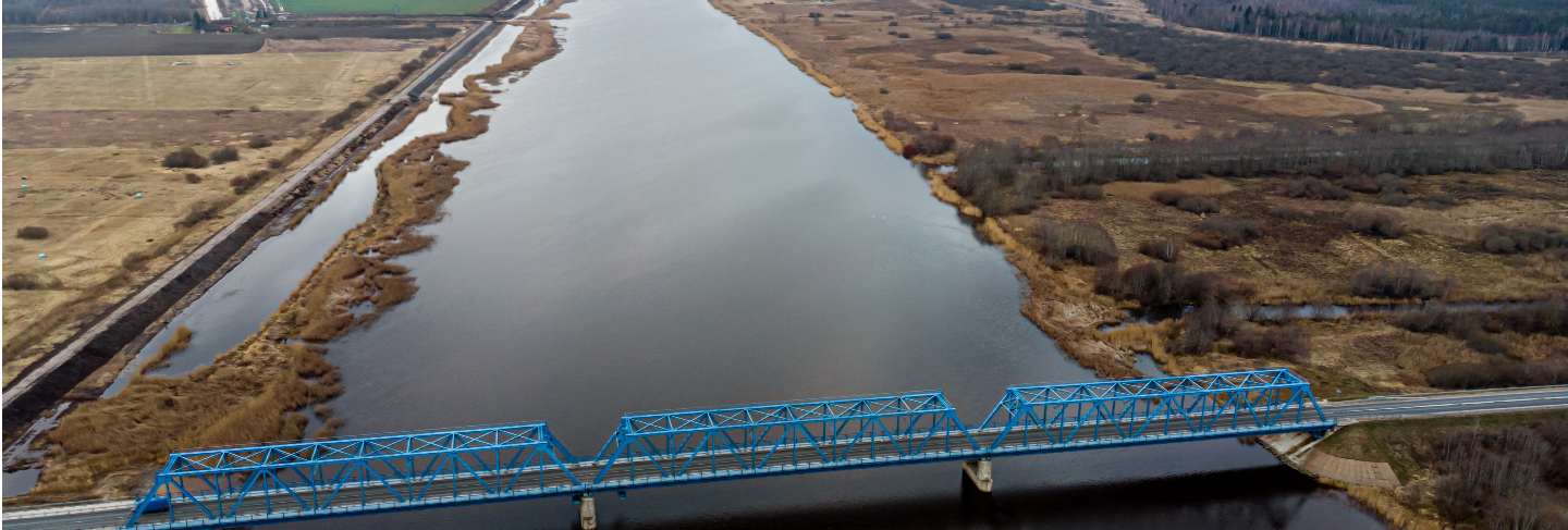Aerial panoramic view to the bridge over the river lielupe near kalnciems, latvia