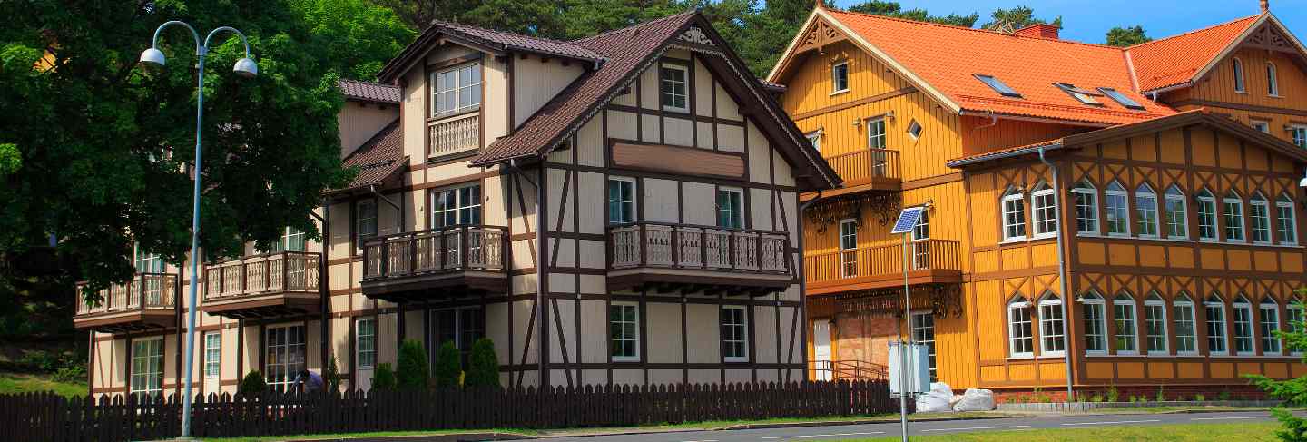 Traditional lithuanian wooden and half-timber houses in the countryside.