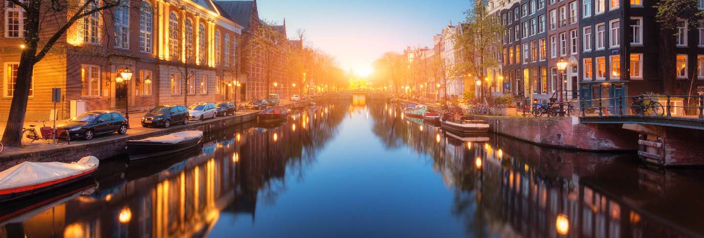 Colorful cityscape at sunset in amsterdam, netherlands