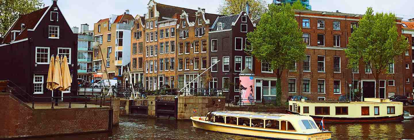 Dark clouds over canal in amsterdam