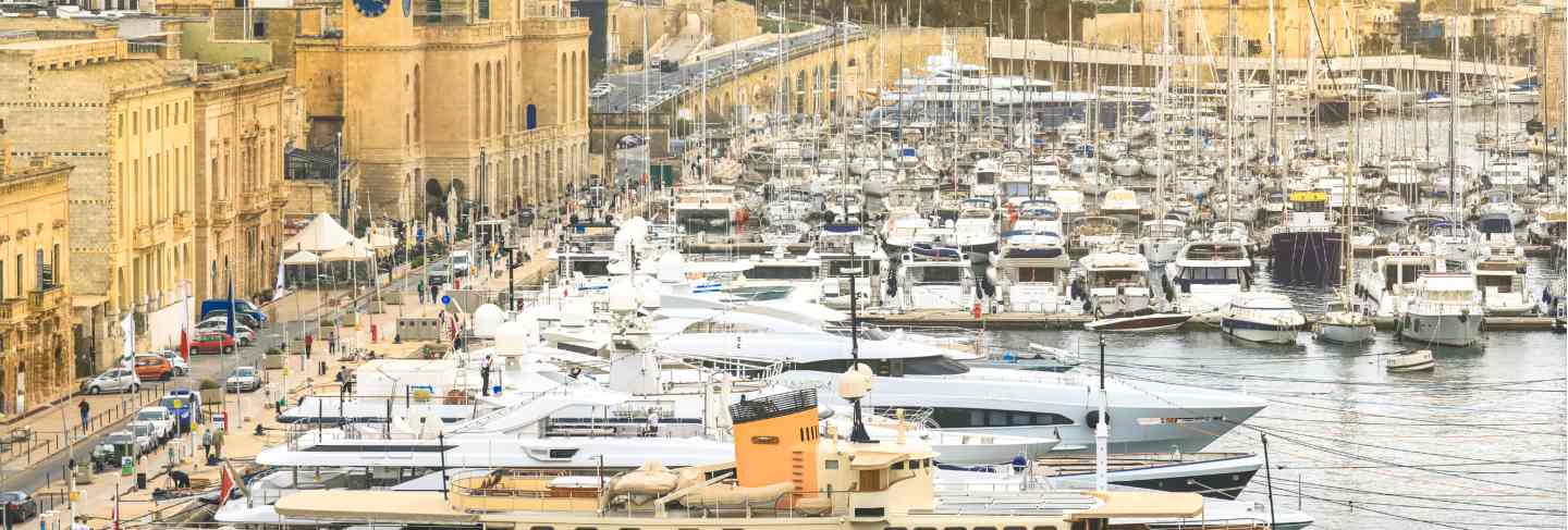 The valletta port is a popular tourist attraction full of cafes and restaurants. Premium Photo