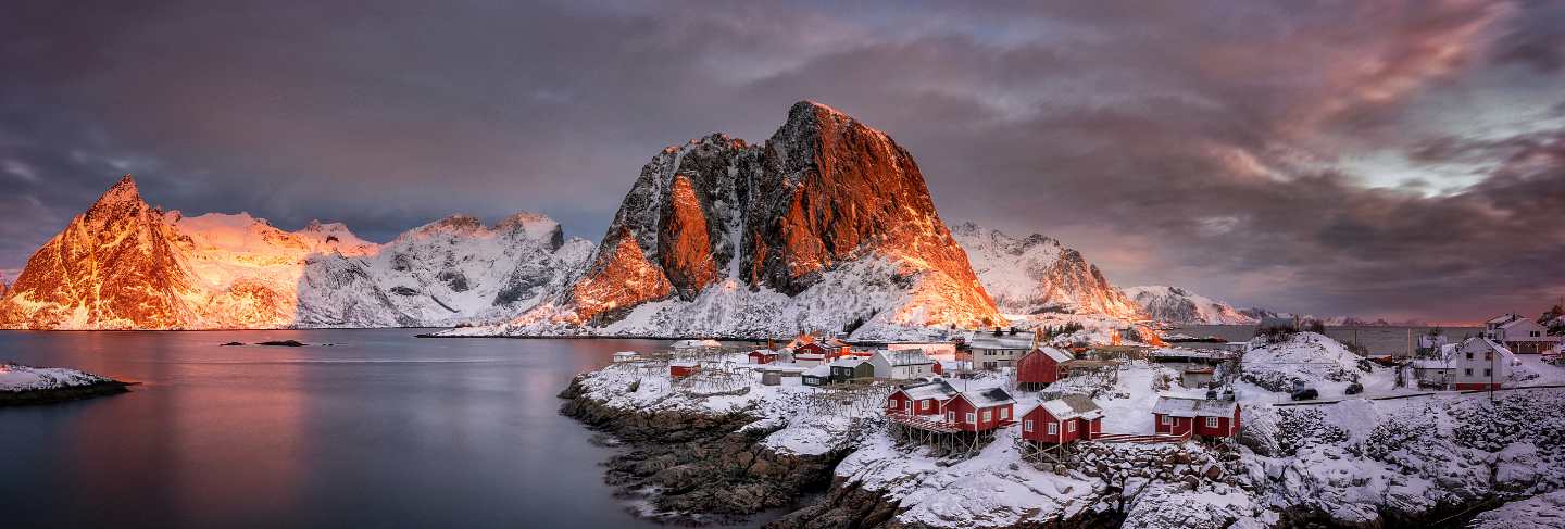 Village with snow and mountains in the arctic, lofoten islands in norway, scandinavia