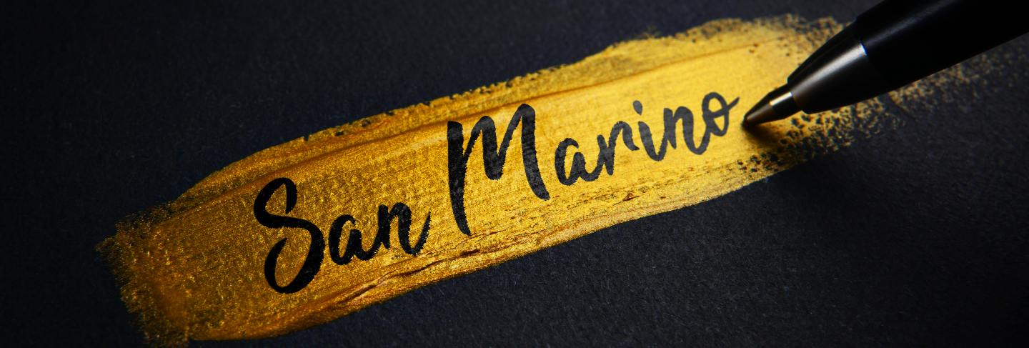 San marino handwriting text on golden paint brush stroke