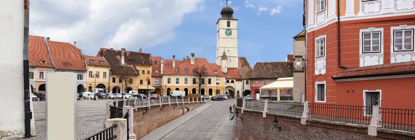 Sibiu city downtown with houses a bridge and a tower with clock, romania