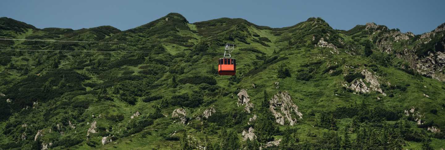 Transfagarasan cable way in green transilvanian carpathian mountains, romania