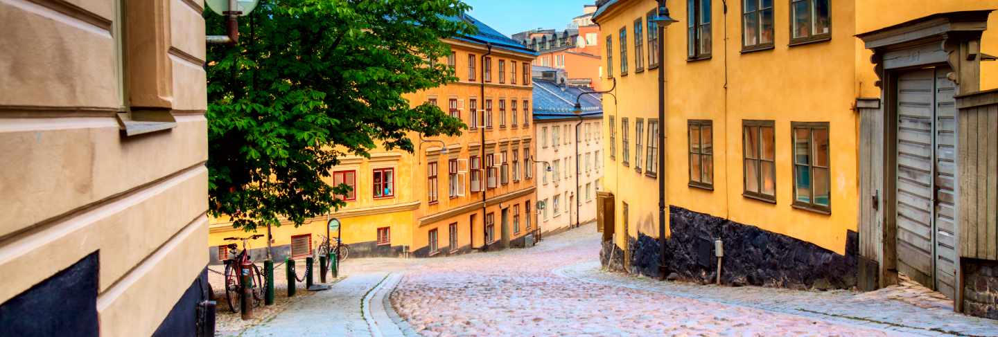 The narrow cobblestone street bastugatan in sodermalm with medieval houses in stockholm at summer sunny day.