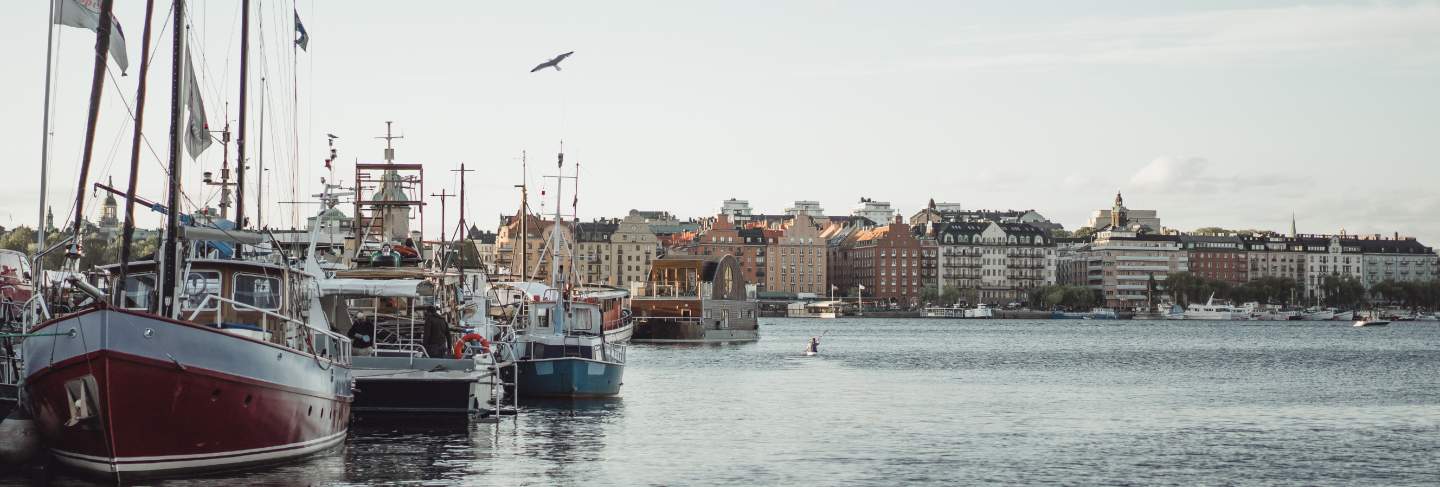 Sailing boats and yachts on the pier in stockholm front of the city center