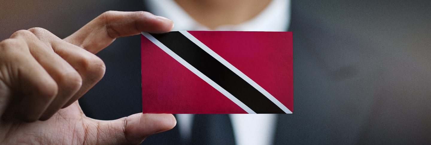 Trinidad and Tobago handwriting text on golden paint brush stroke