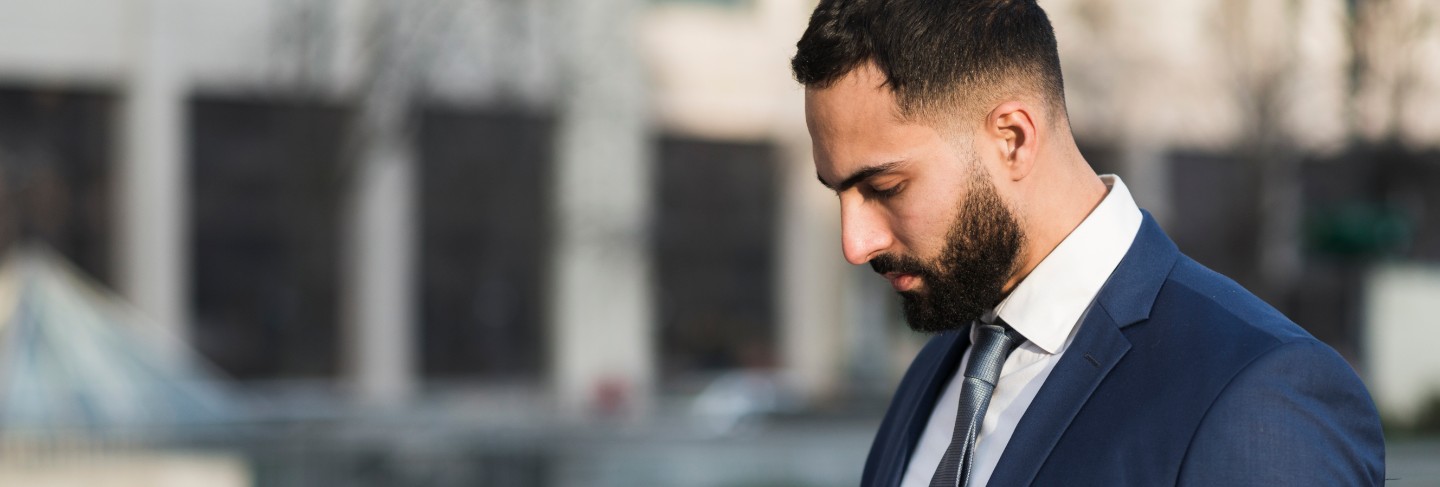 Side view business man checking clipboard