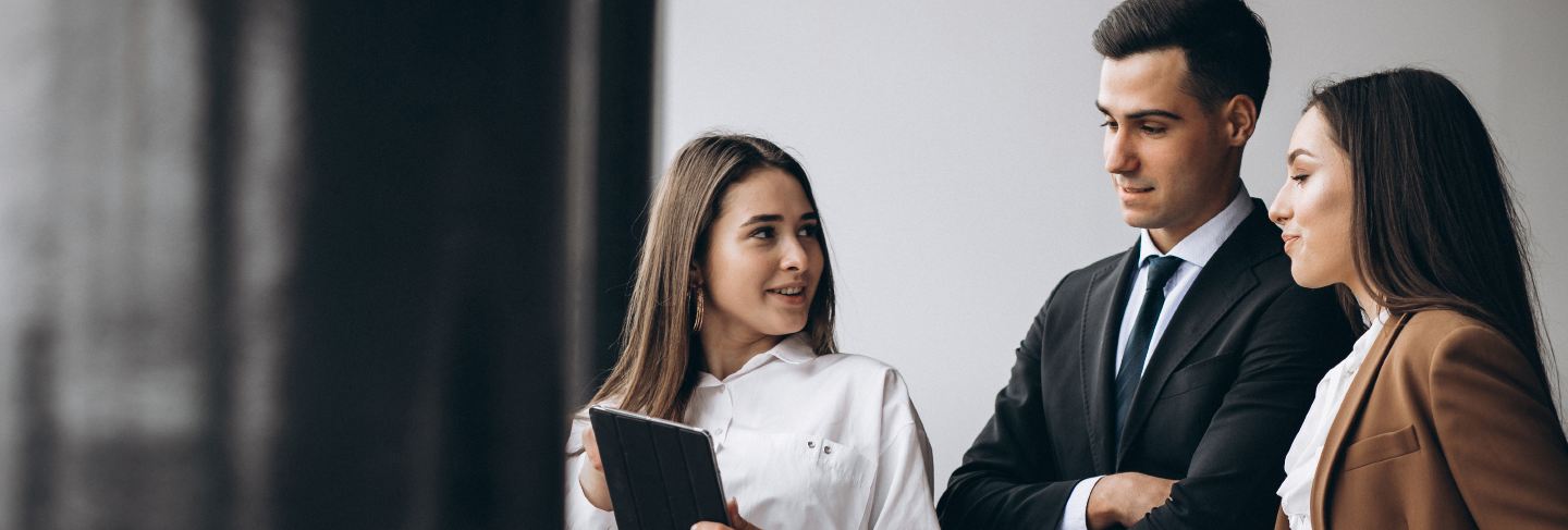 Male and female business people working on tablet in office