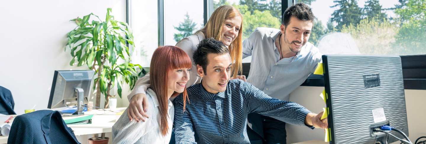 Group of young people employee workers with computer in urban alternative office