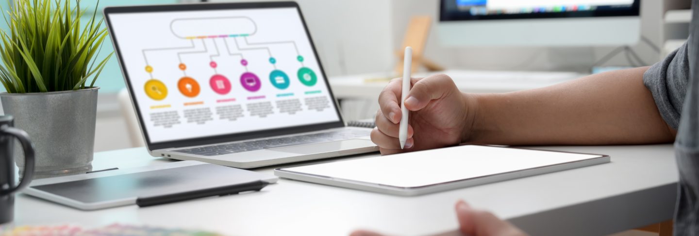 Cropped shot of graphic designer working on infographic project