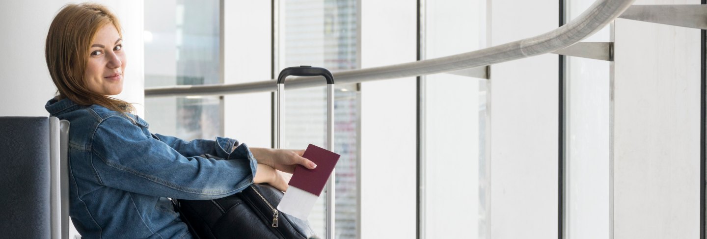 Side view of woman waiting for plane