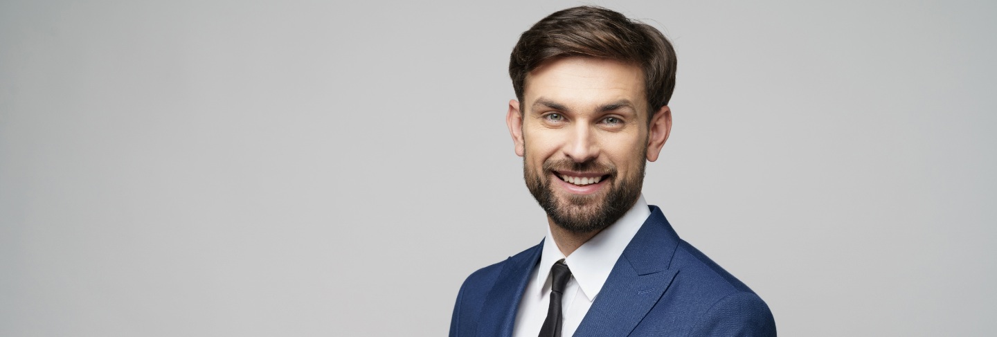 Portrait of businessman talking on phone in office