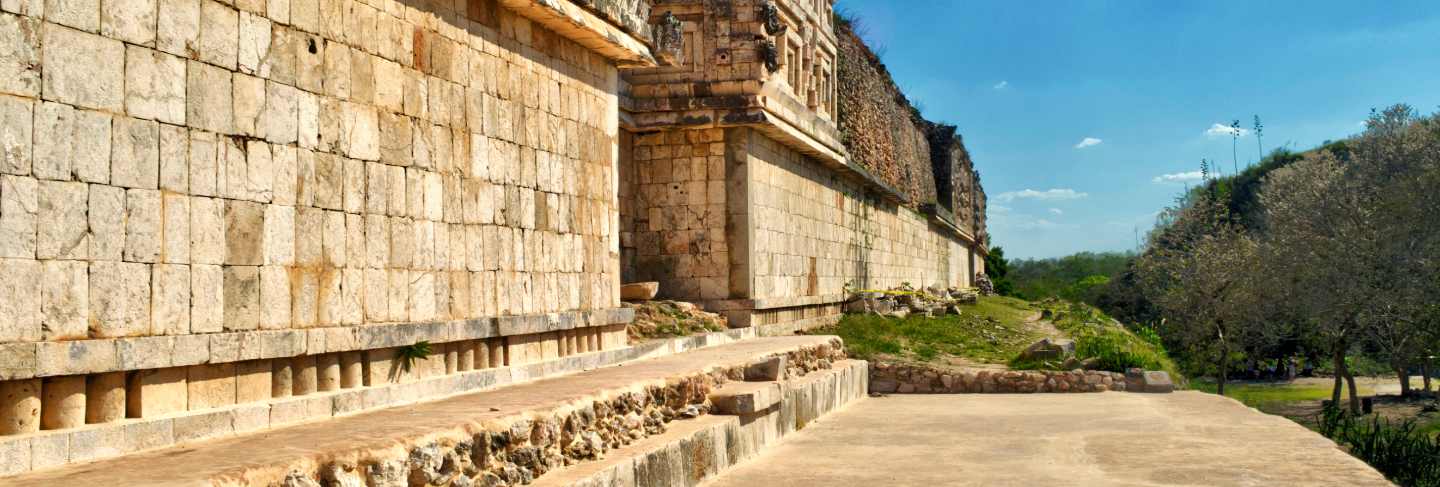 Stones carved in buildings surrounding the courtyard of uxmal. uxmal archaeological site, located in yucatan. beautiful tourist area.
