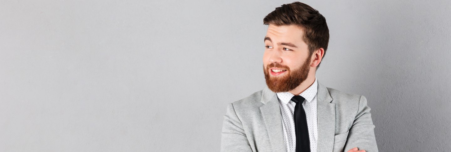 Portrait of a smiling businessman dressed in suit
