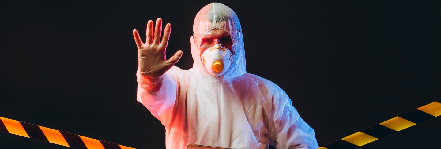 Epidemiologist on protective clothes on restricted area
