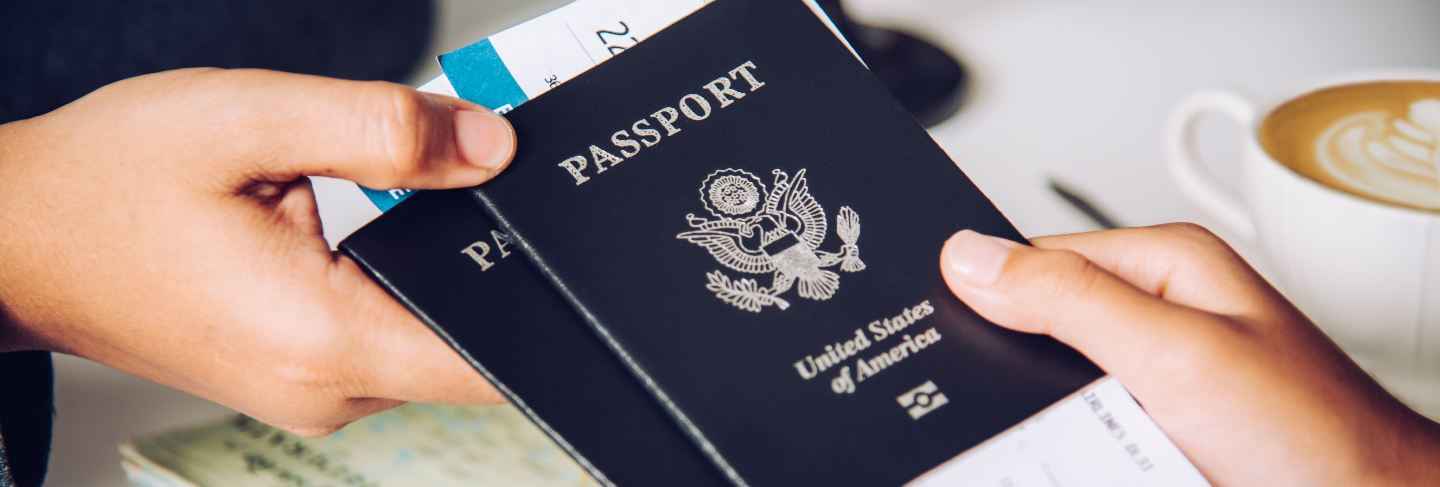 Hand for tourist holding passport to authorities