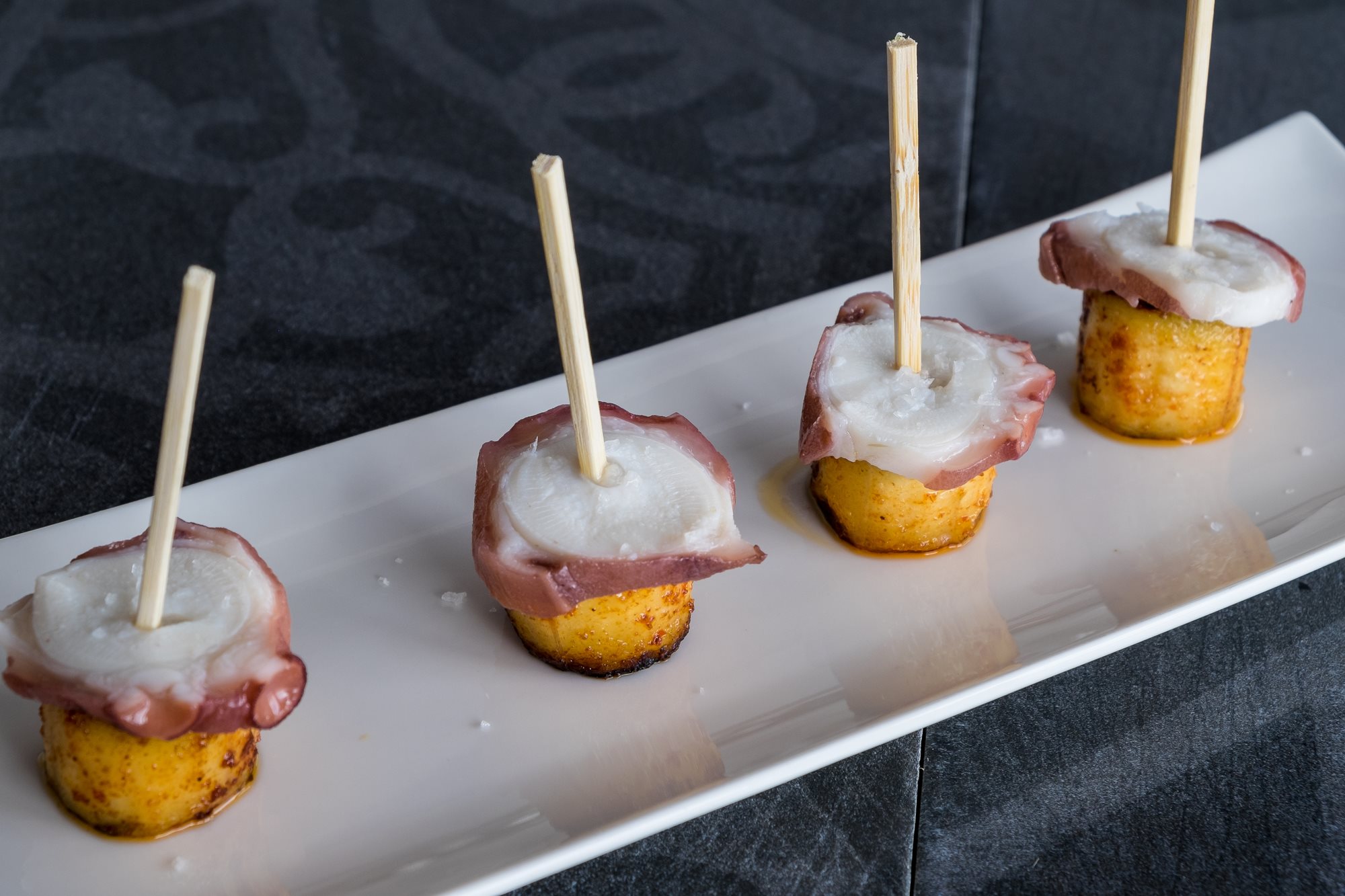 Pincho de plátano con pulpo y mojo rojo. Pincho de plátano con pulpo y mojo rojo.