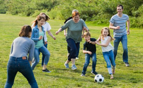 males and females kicking the ball males and females kicking the ball