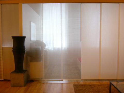 View toward squeen bed sleeping area with fabric dividers closed
