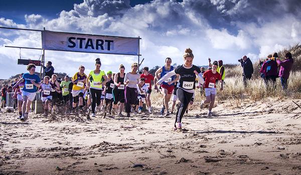Get muddy in the sunny south east with the beach bog run