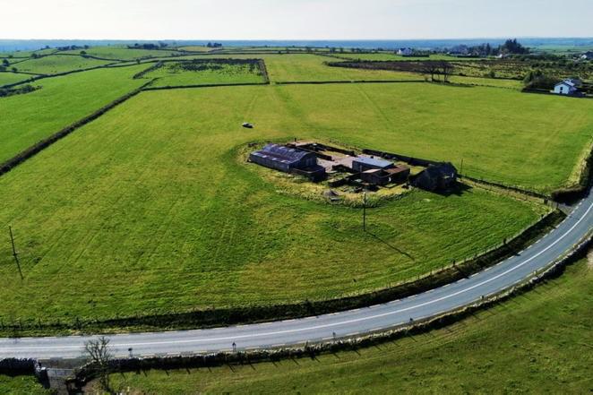 Nice land with old house and yard near road