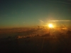 Klik om te vergroten Brisbane: Opgaande zon vanuit het vliegtuig