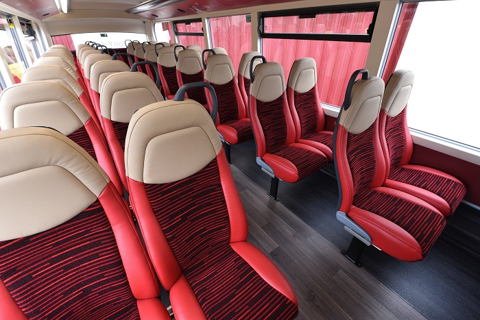 Comfy-looking red and cream bus seats