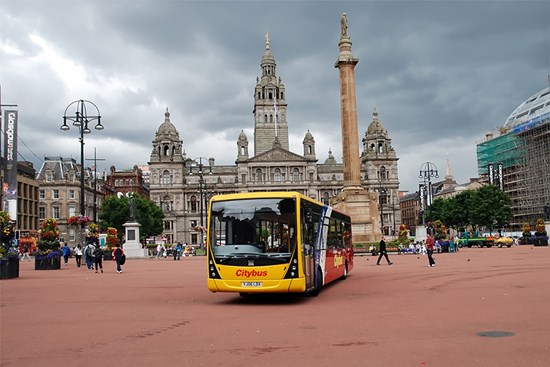 yellow and red bus parked up on George Square