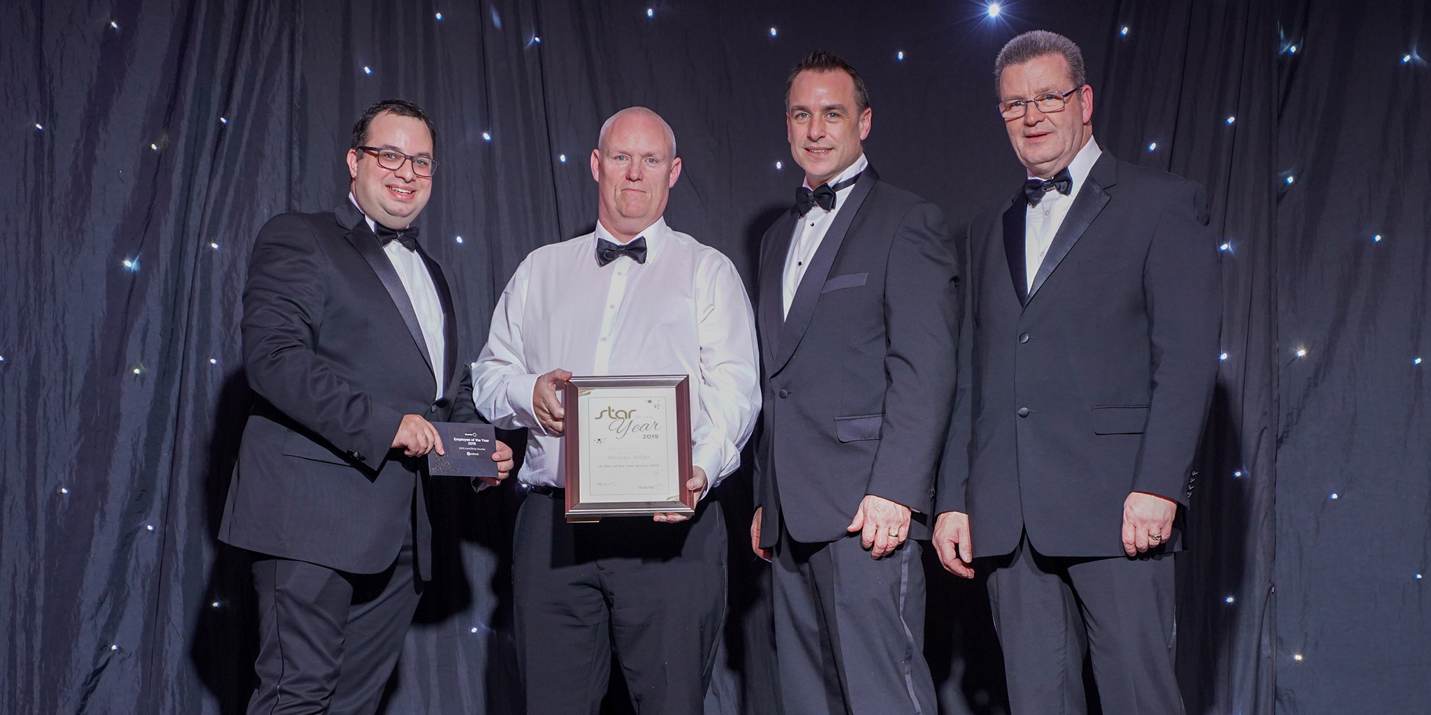 Photo of Bluestar employee of the year Alistair Allan and Bluestar directors, David Lee-Kong, Ben Murray and Steve Hamilton