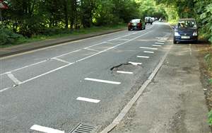 Council paints over potholes
