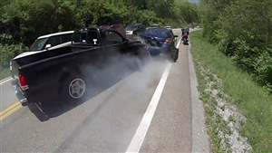 Biker has a scary near-miss