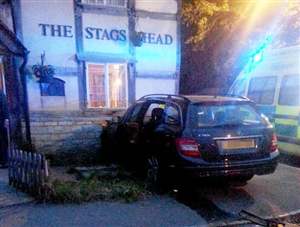 Mercedes smashes through pub