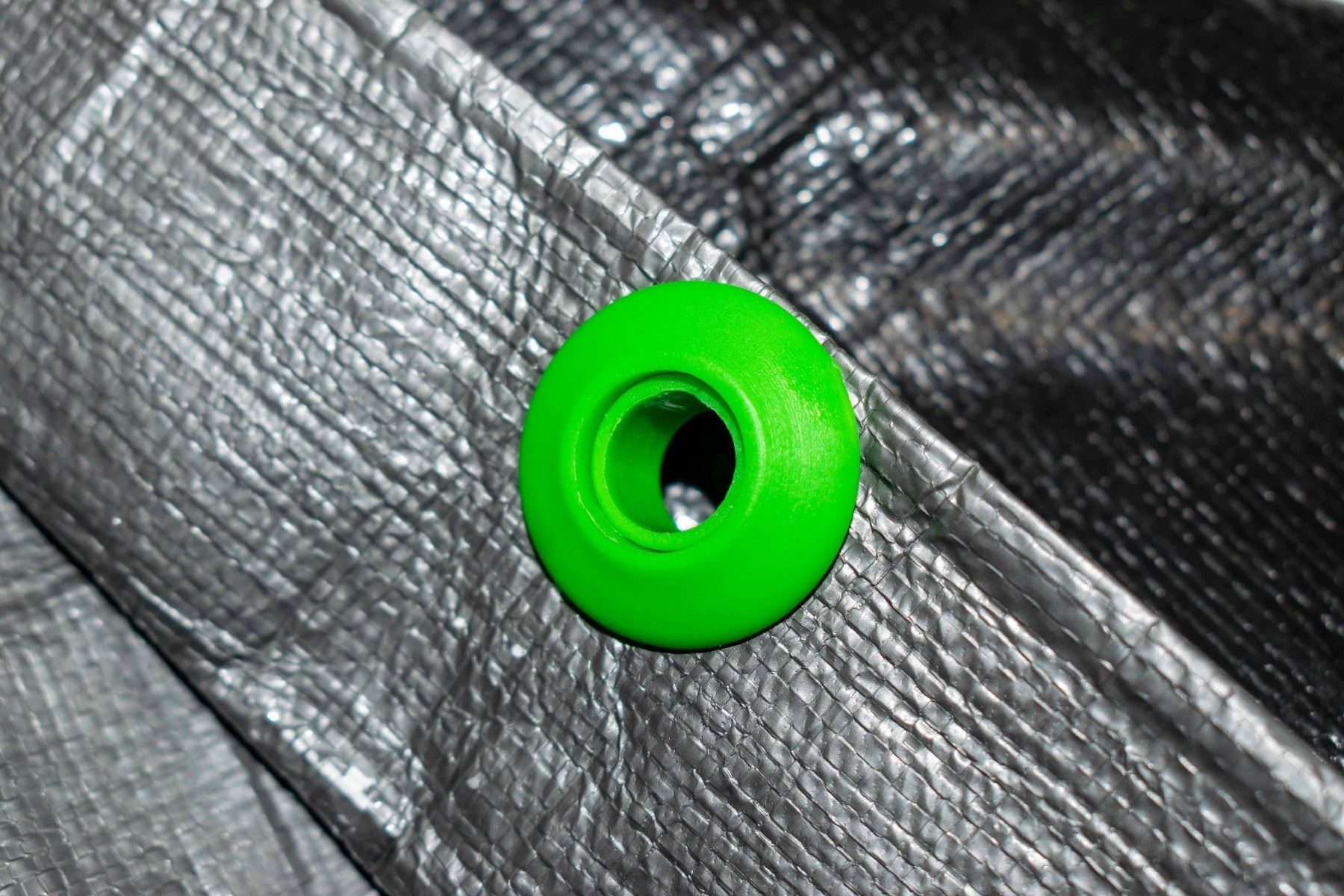 Close up view of Green and Blue Male and Female Plastic Grommet Snap Eyelet Components