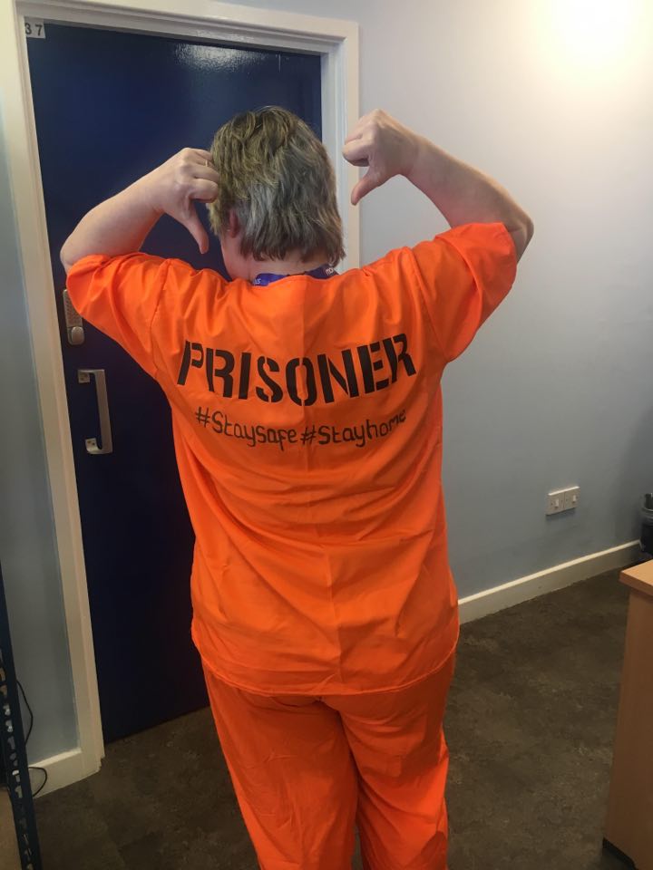 Photo of a morebus bus driver in orange prison scrubs