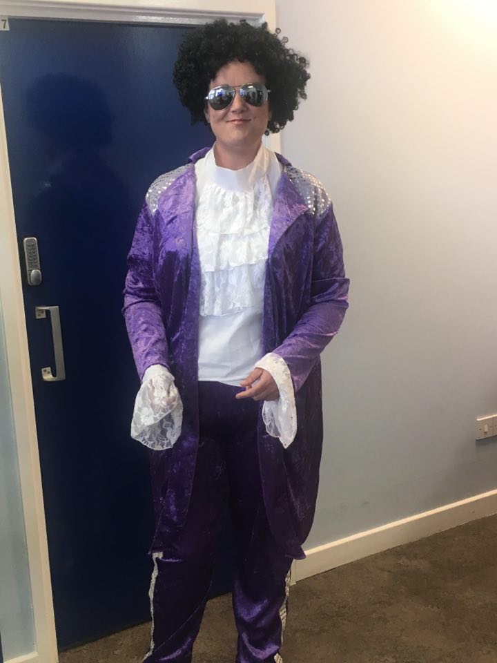 Photo of a morebus bus driver dressed as Prince