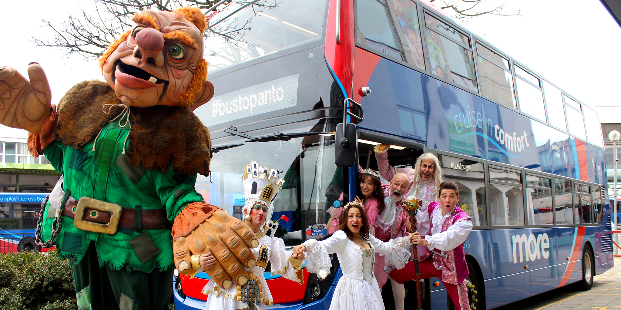 Photo of the cast of Jack and the Beanstalk cast in front of a morebus vehicle