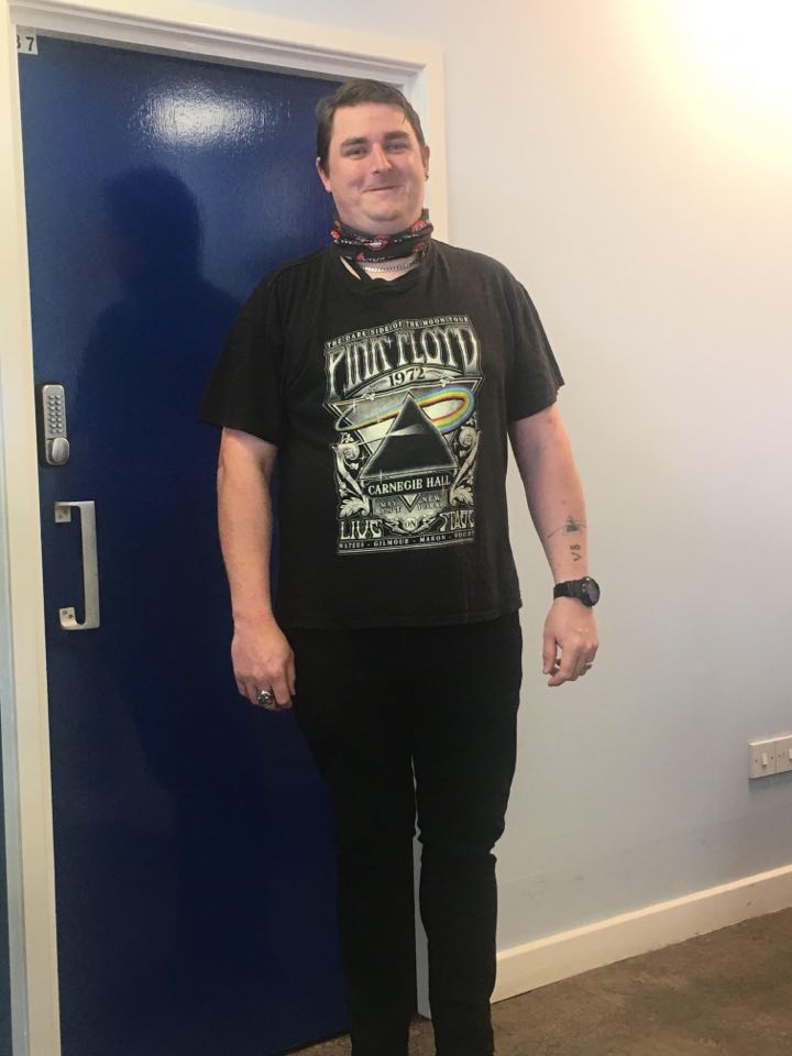 Photo of a morebus bus driver with a rainbow on their t-shirt