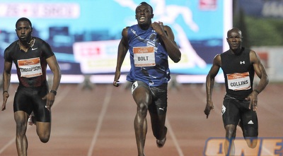 קולינס ותומפסון לוחצים. בולט מסיים ראשון (רויטרס)