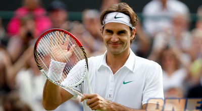 רוג´ר פדרר מאושר לאחר הטיול הקליל על הדשא (GettyImages)