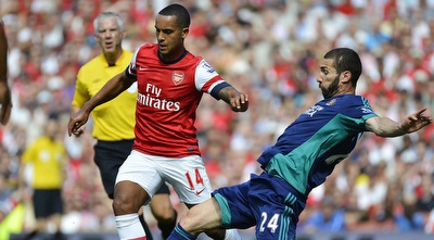 ת´יאו וולקוט עובר את קרלוס קוייר (רויטרס)