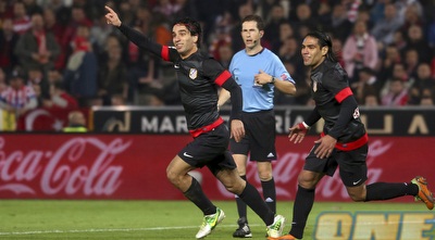 ארדה טוראן וראדמל פלקאו חוגגים (רויטרס) ארדה טוראן וראדמל פלקאו חוגגים (רויטרס)