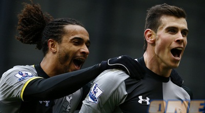 גארת´ בייל חוגג עם בנואה אסו אקוטו. טריפל אישי (רויטרס)