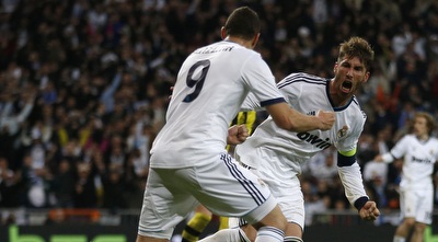 סרחיו ראמוס חוגג עם קארים בנזמה (רויטרס)