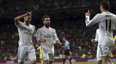 בנזמה חוגג עם בייל וקרבחאל (רויטרס)