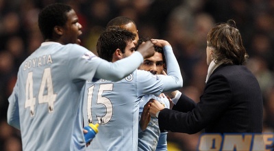 טבס והחברים חוגגים עם מנצ´יני (רויטרס)