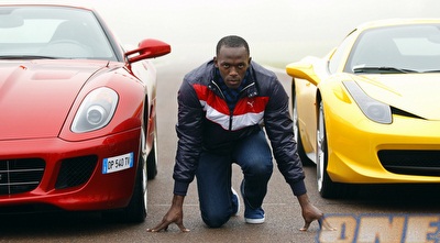 בולט מול מכוניות פרארי. על מה הייתם שמים את הכסף שלכם? (רויטרס)